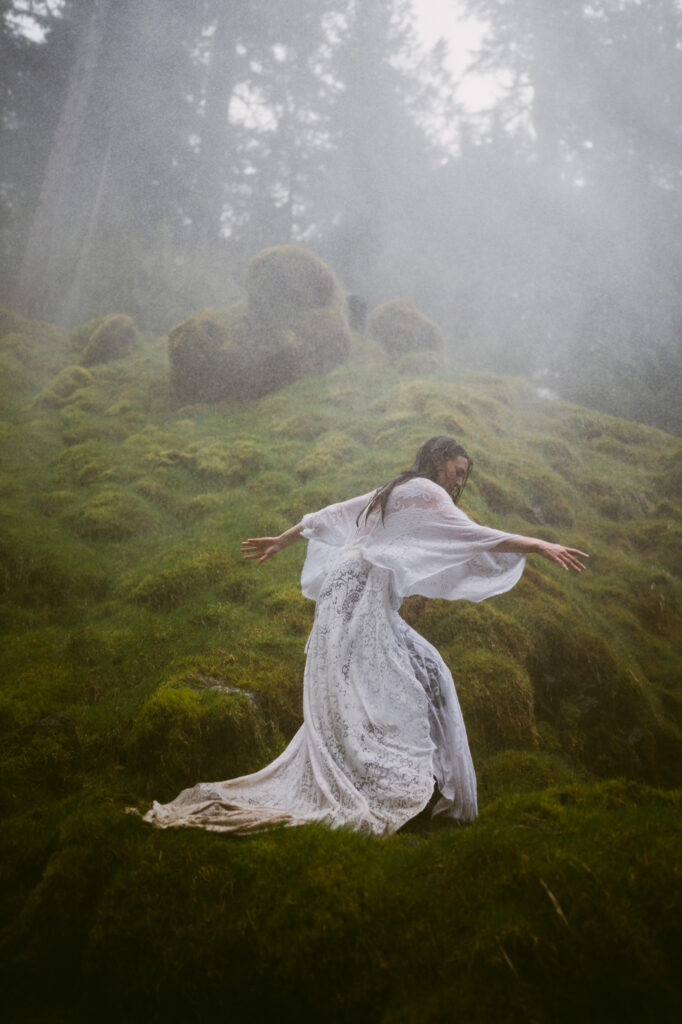 A detail shot of the bride's soaked and muddy dress as she walks away from the camera.