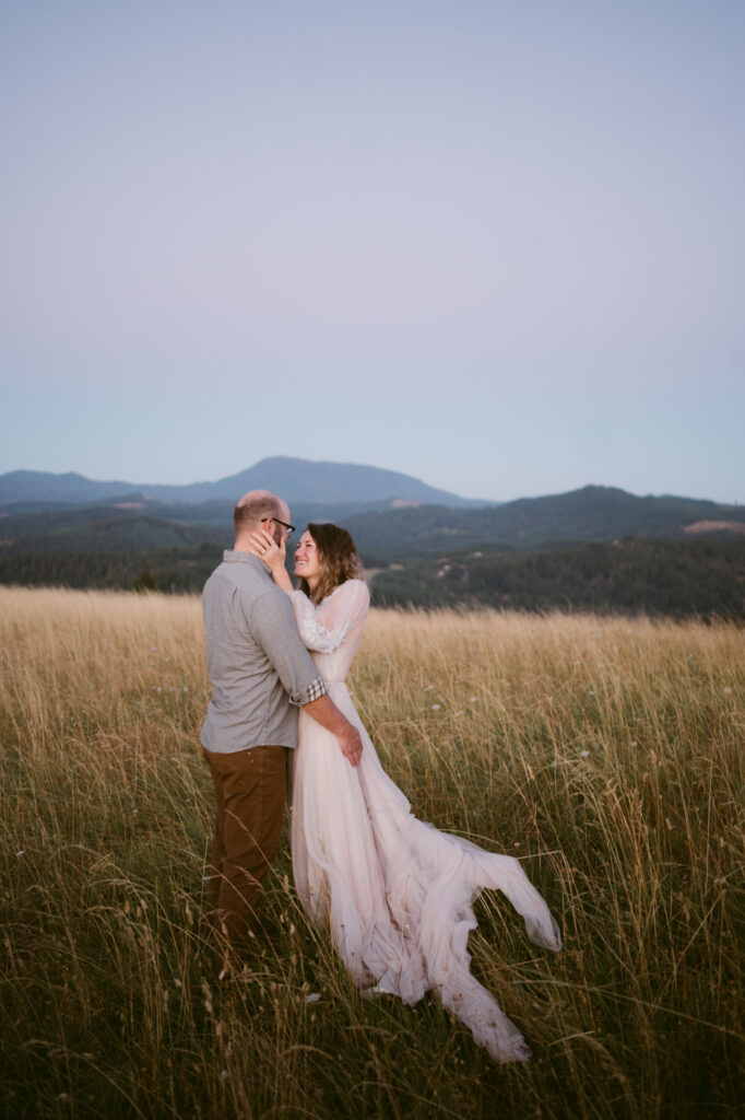 A husband and wife cuddle together during their Fitton Green anniversary session in Corvallis, Oregon.