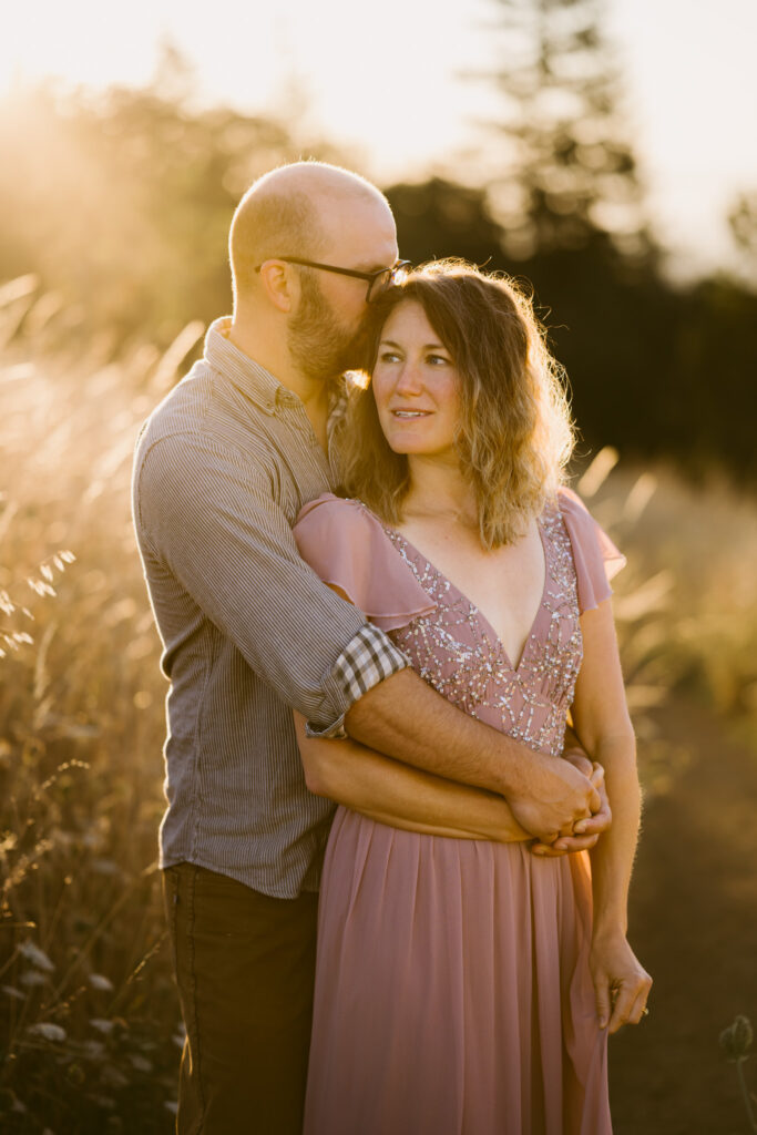 Warm rays of sun bathe a married couple in light as they pose for their anniversary photos at Fitton Green.