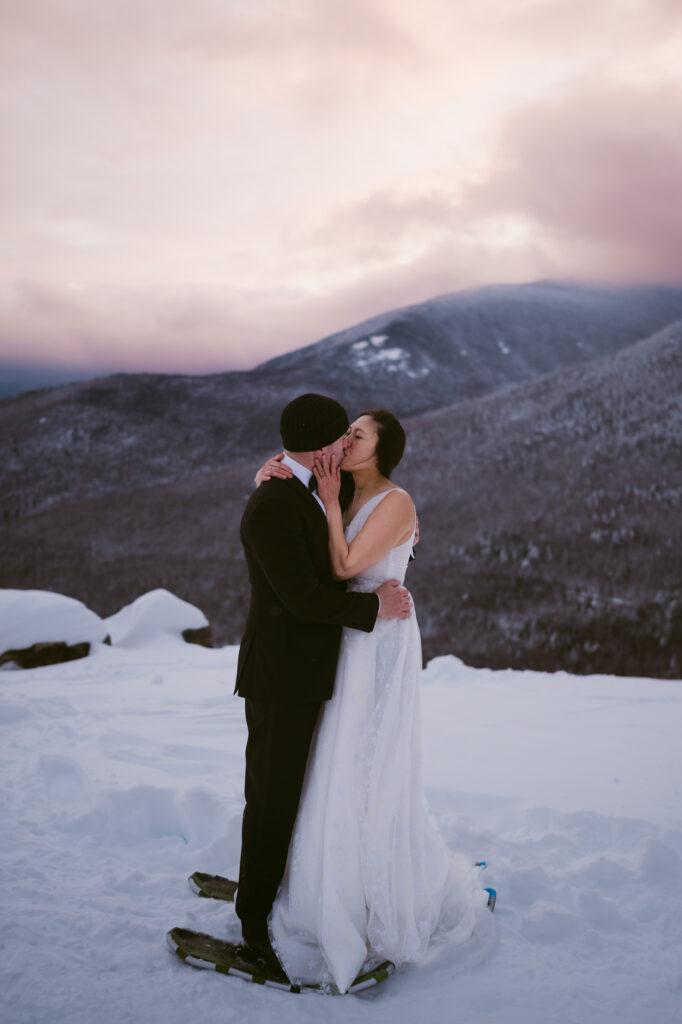 A bride and groom kiss at Cobble Lookout during their Lake Placid elopement.