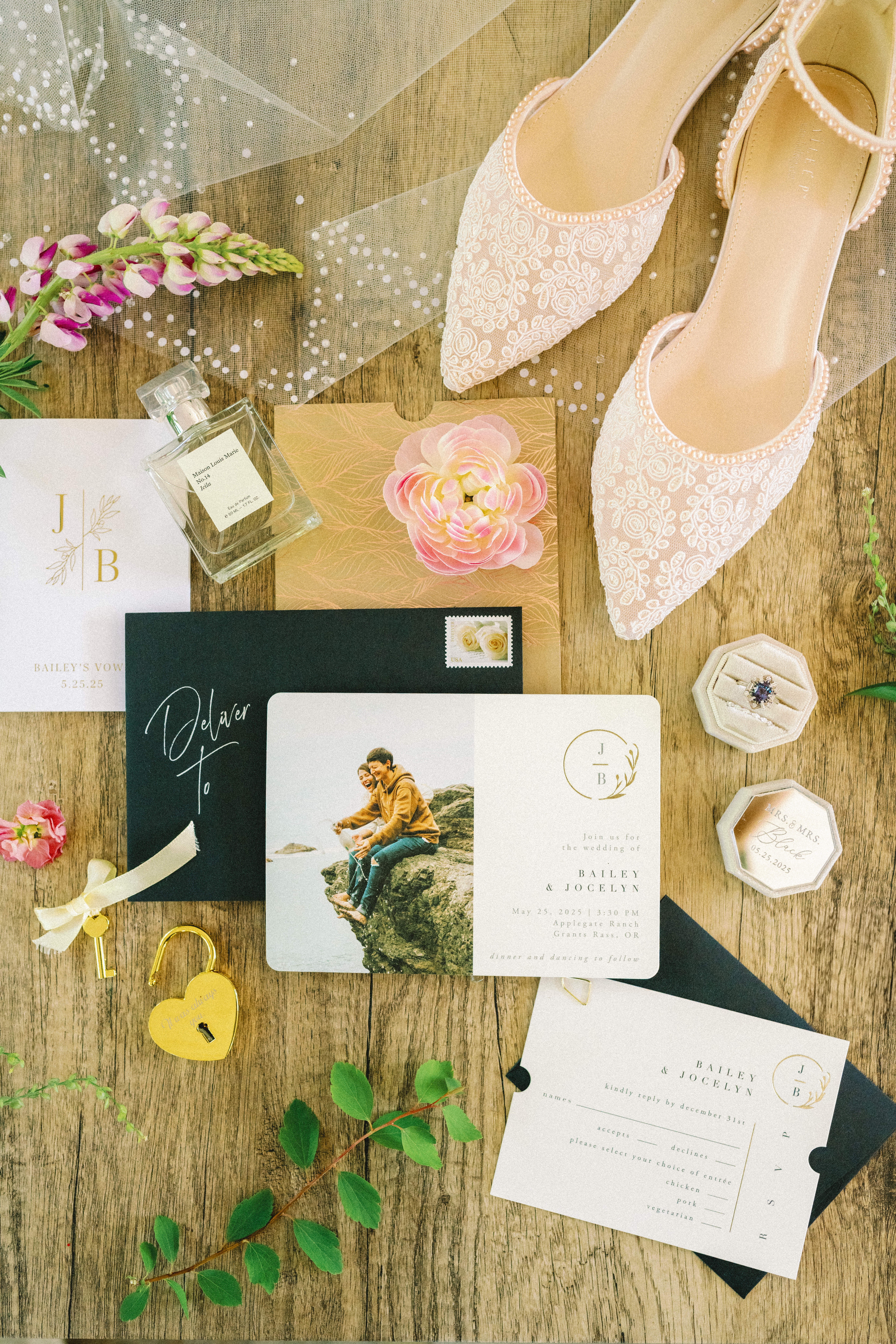 Flat lay of wedding day details including embroidered bridal shoes, custom invitations, vow books, and personal touches for Bailey and Jocelyn’s Applegate Ranch wedding.
