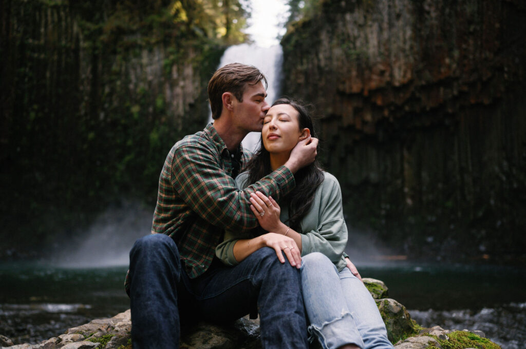 A couple pauses for an intimate moment during their Abiqua Falls engagement session.