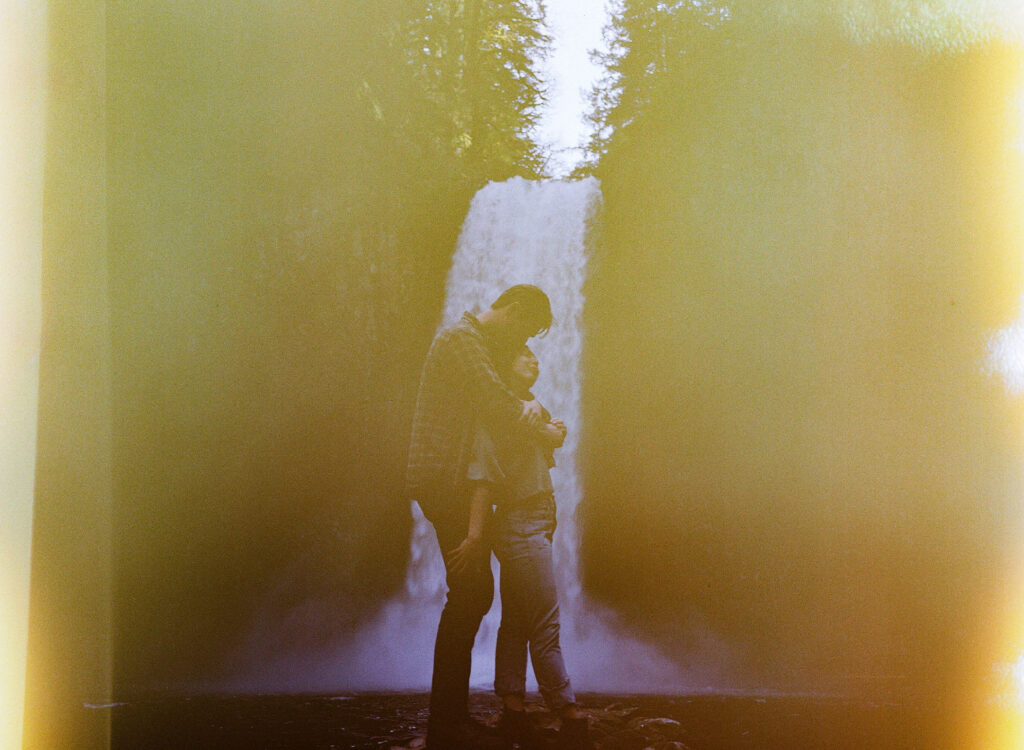 A medium format film scan showcasing creative light leaks taken during an engagement session at Abiqua Falls.