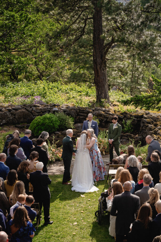 Wide overhead view of the wedding recessional at the Griffin House, with family and friends gathered in the Columbia River Gorge.