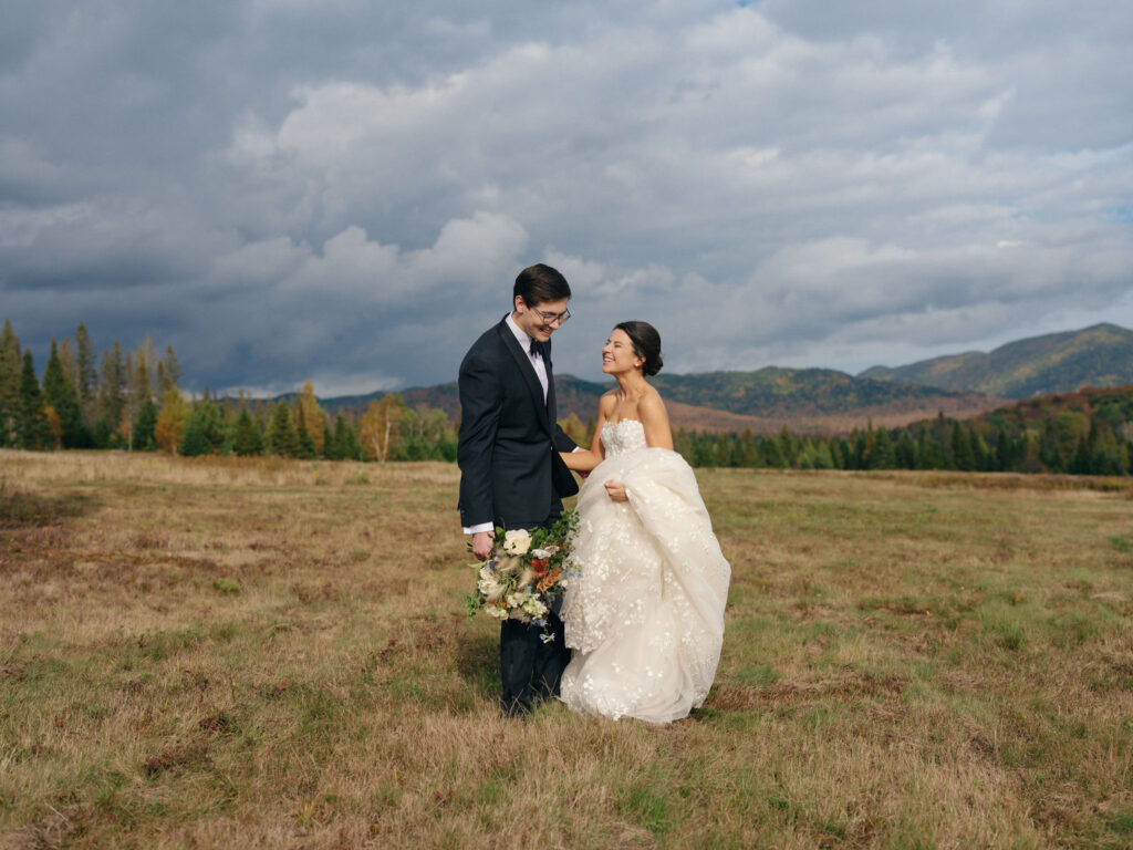 Lake Placid wedding couple portraits at a private estate with Adirondack mountains and fall foliage