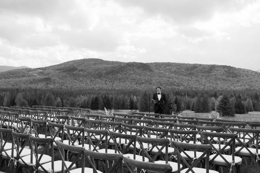 Ceremony chairs set against Adirondack mountain backdrop at Lake Placid private estate wedding