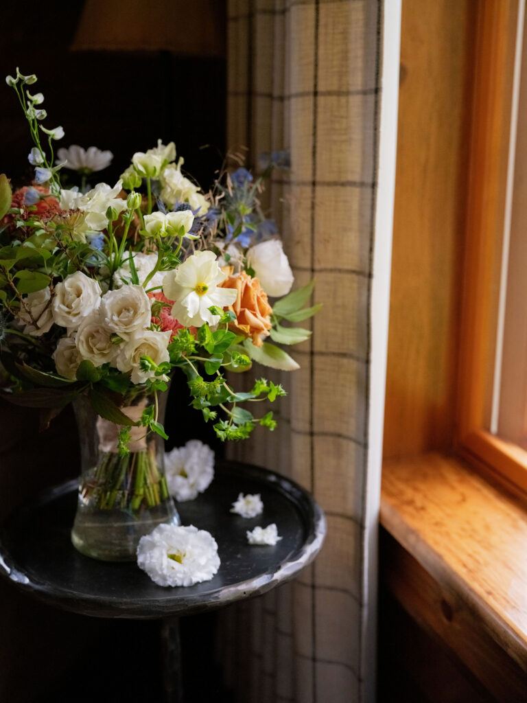 Lake Placid private estate wedding bridal bouquet with garden-inspired florals in natural window light