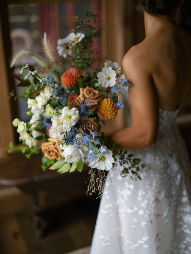 Garden-inspired bridal bouquet with soft florals during a Lake Placid private estate wedding
