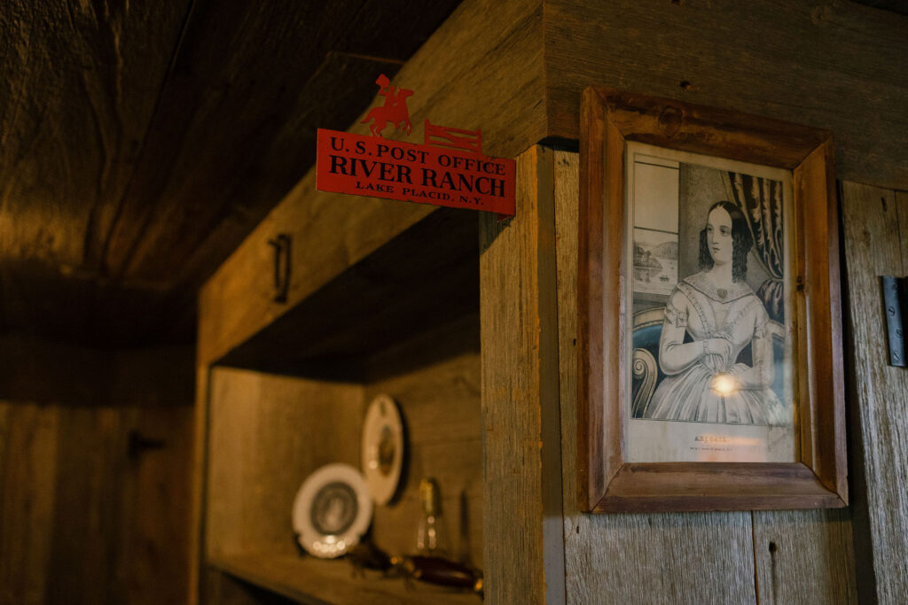 River Ranch Lake Placid sign and rustic cabin interior details with framed artwork and wood textures