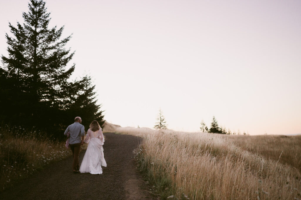 A married couple walk hand-in-hand along a footpath at Fitton Green in Corvallis, Oregon.