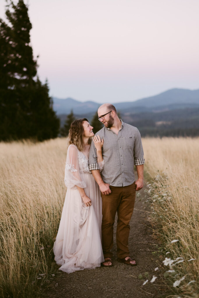 A husband and wife celebrate their wedding anniversary by taking photos at Fitton Green in Corvallis, Oregon during sunrise.
